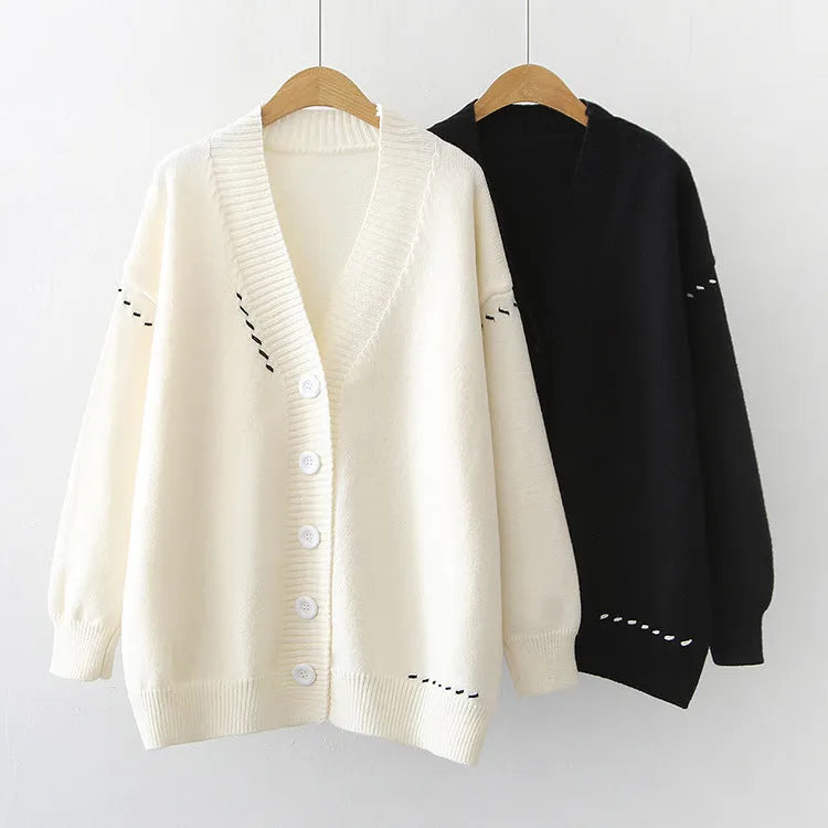 Women's loose knitted cardigan coat in solid white or black colour with long sleeves