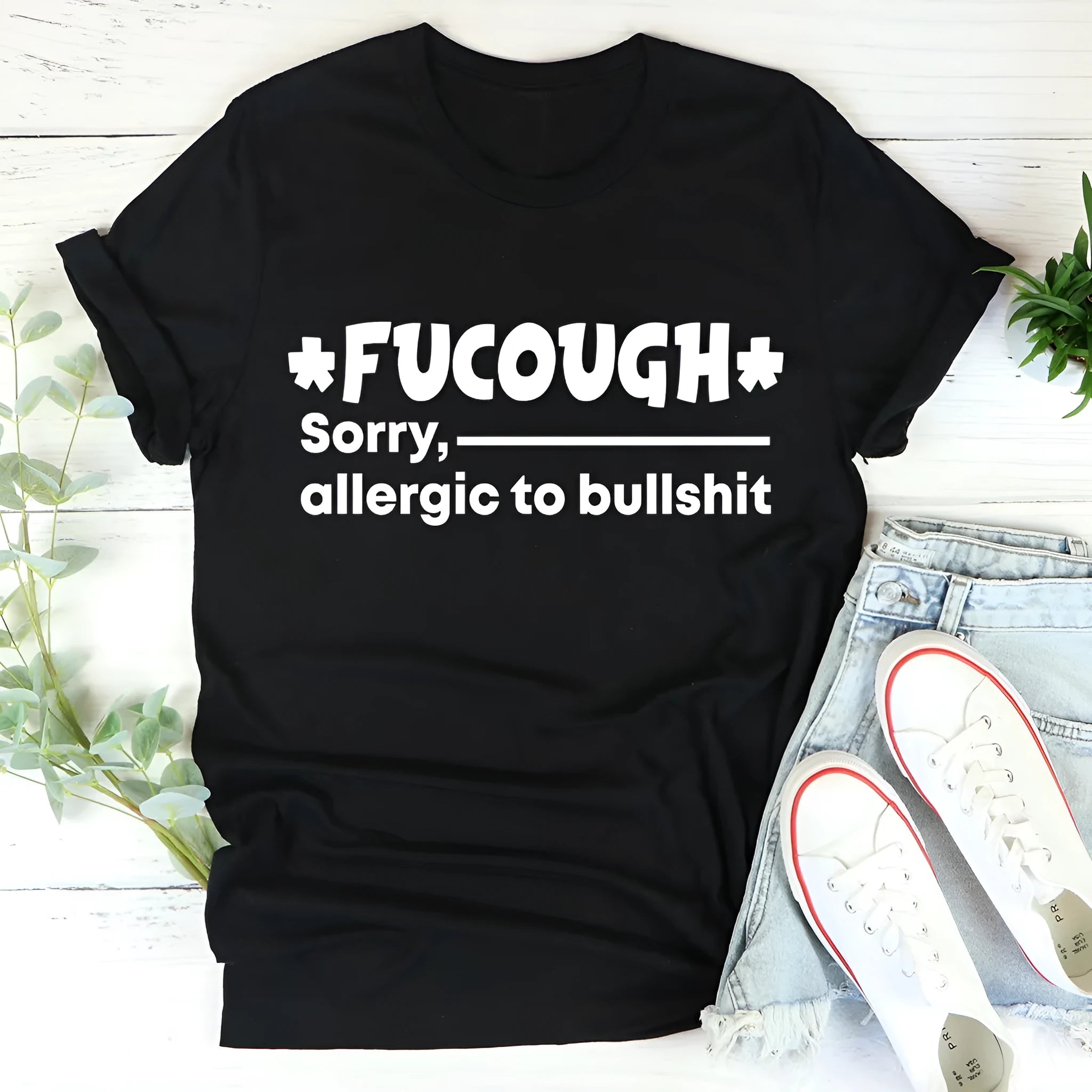 Black loose fit cotton t-shirt with short sleeves and round neck on hanger
