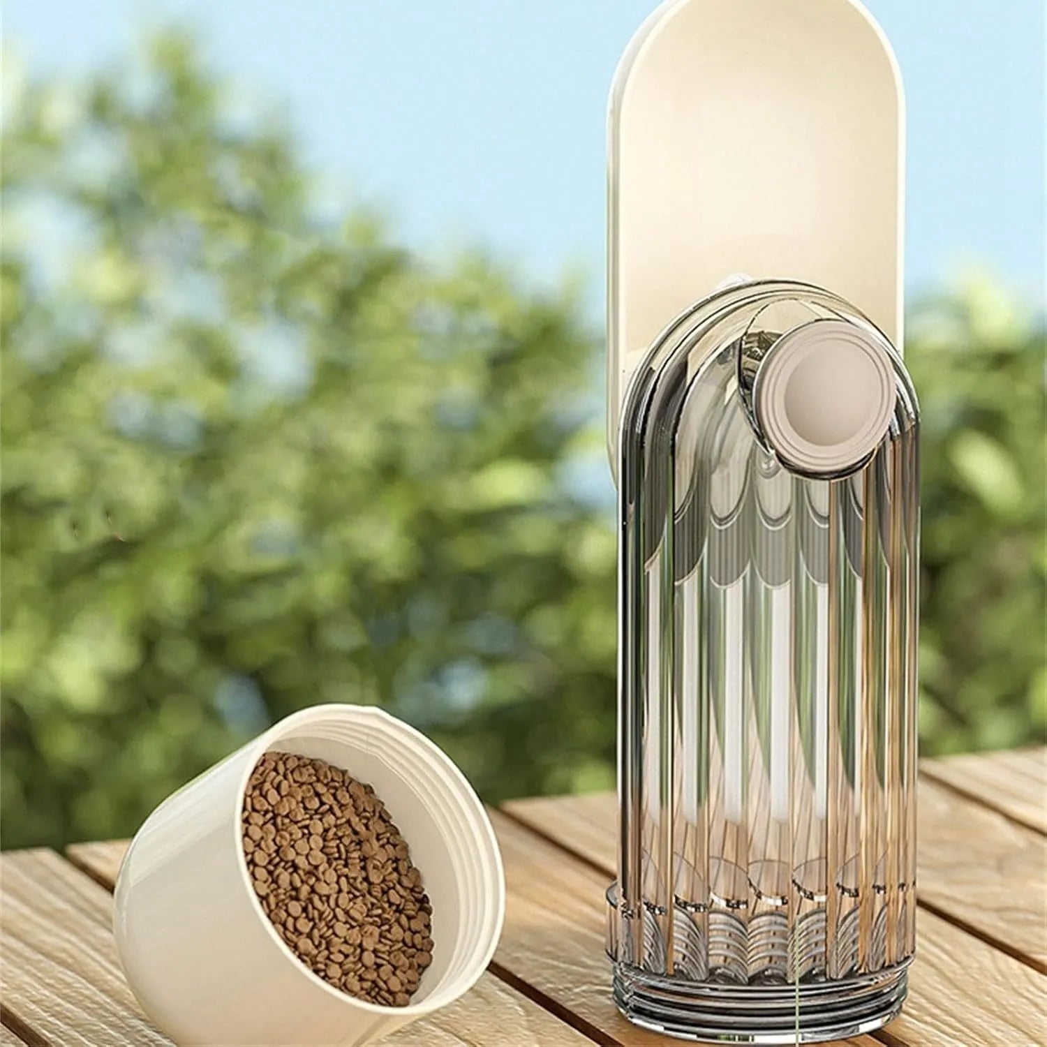 Foldable dog water bottle with food dispenser in beige colour for outdoor walking