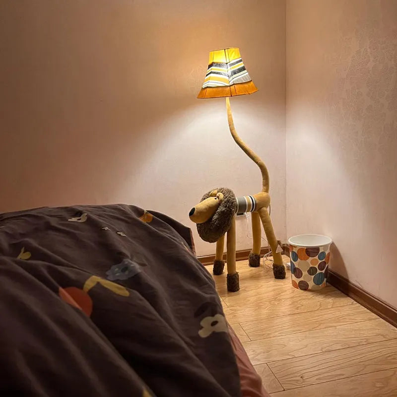 Hand-knitted cloth children's cartoon floor lamp with Christmas deer or lion design in a bedroom setting