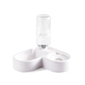 White automatic pet water fountain with stainless steel top on a floor.
