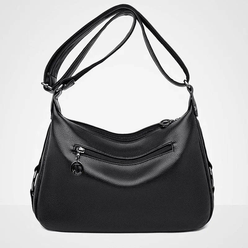 Large black PU shoulder bag with crossbody strap showing multiple internal compartments and zipper closure