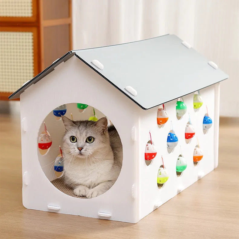 Plastic cat scratch board house with integrated nest bed, bell ball toy, and tunnel opening for indoor feline use