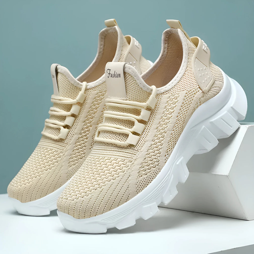 Men's white Flyknit lace-up running sneakers with a thick PVC sole on a plain background.