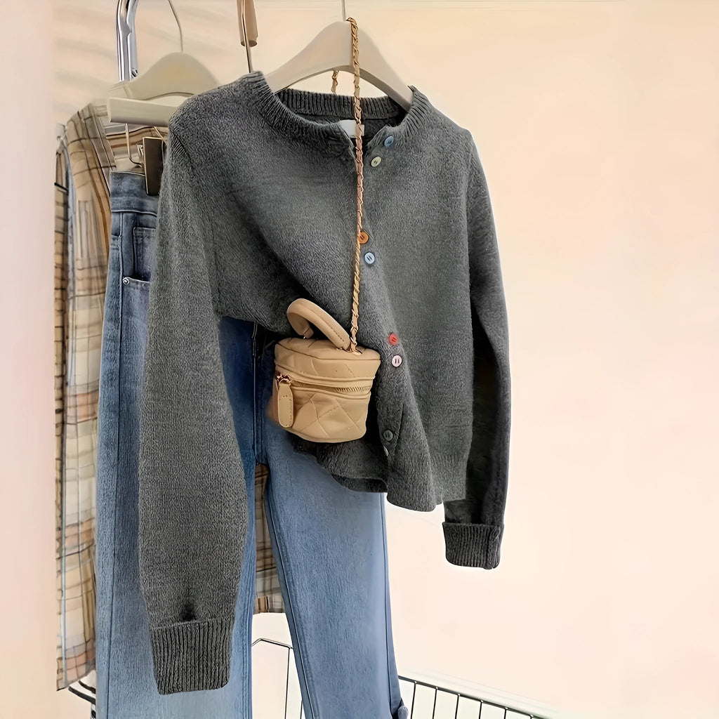 Women's dark grey button-front cardigan sweater with long sleeves on a hanger.