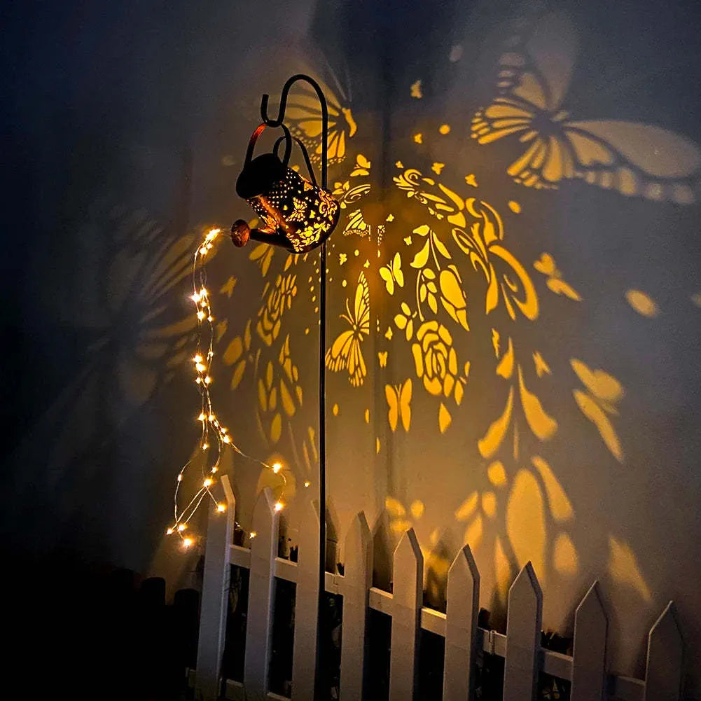 Iron solar garden lamp with tapered butterfly pattern and warm white LED lighting