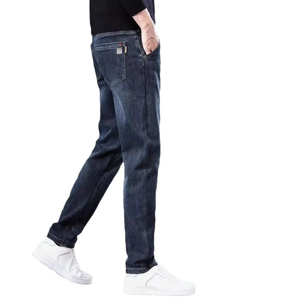 Blue grey and black slim straight loose casual thin trousers on a hanger, showing mid waist and zipper fly.