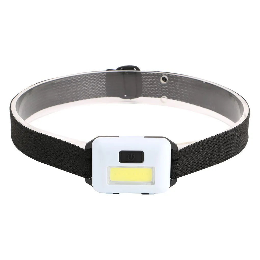 Compact black, blue, or red outdoor LED headlamp with adjustable strap on a grey background