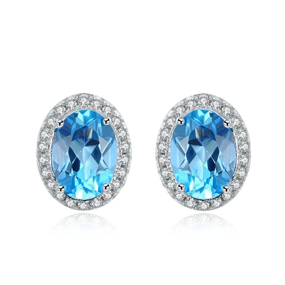 925 sterling silver jewellery set with blue topaz gems including earrings, ring, necklace and pendant