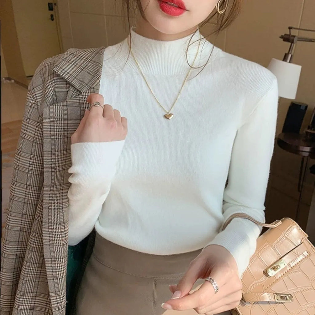 Women's slim fit knitted bottoming shirt in viscose fibre with long sleeves, shown in apricot colour