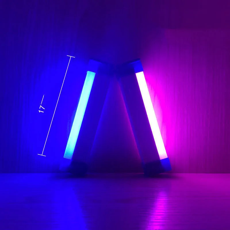 Blue and purple rechargeable dimmable LED tube stick light in 32cm length on a dark surface.