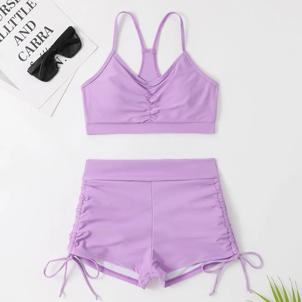 Women's high waist split swimsuit in black or purple colours with sleeveless design