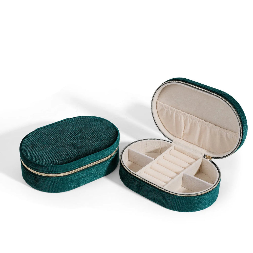 Oval velvet jewellery storage box in lake blue colour showing flannel interior and compact 15x10x5cm dimensions