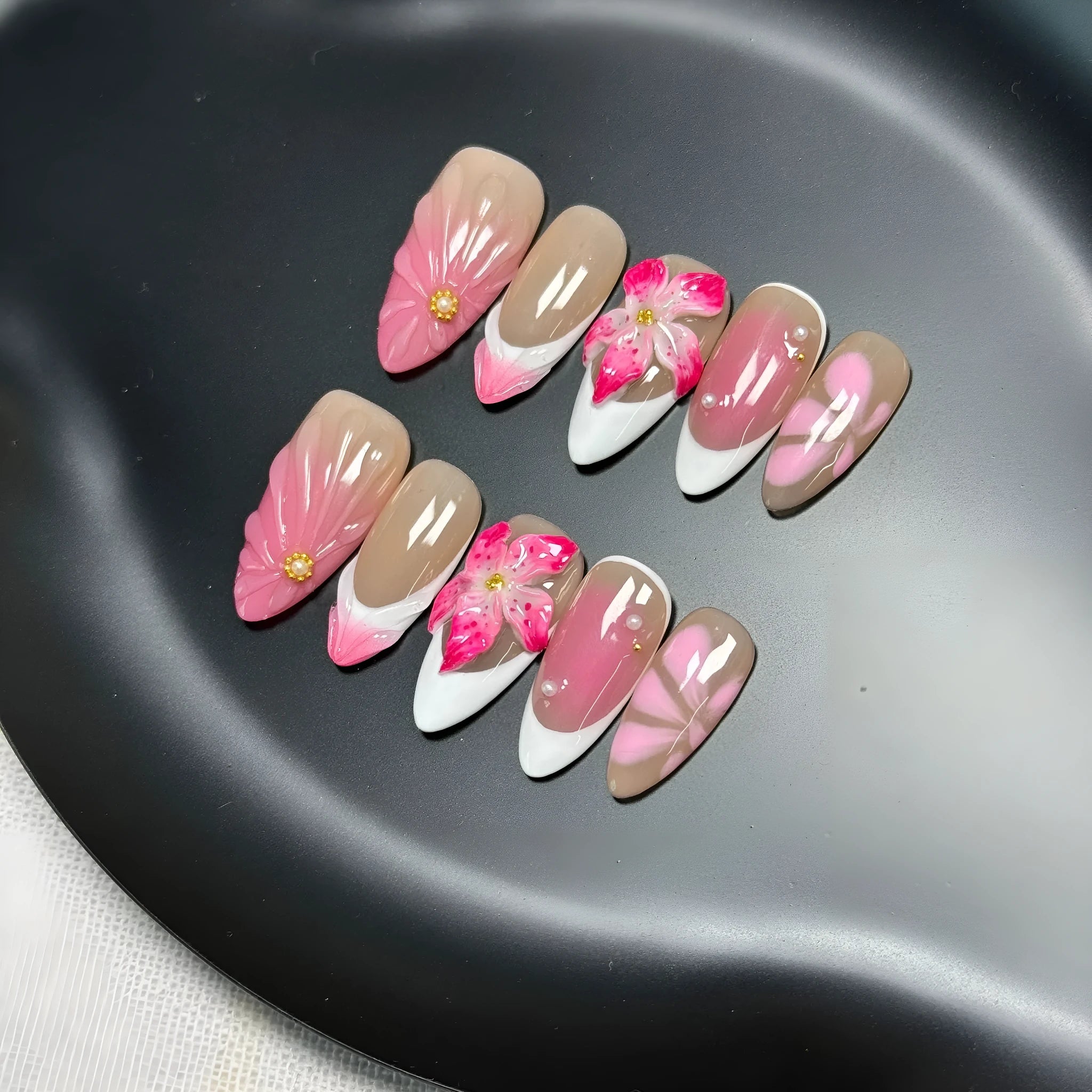 French style artificial nails with three-dimensional fluid ice flower designs on almond-shaped plastic tips