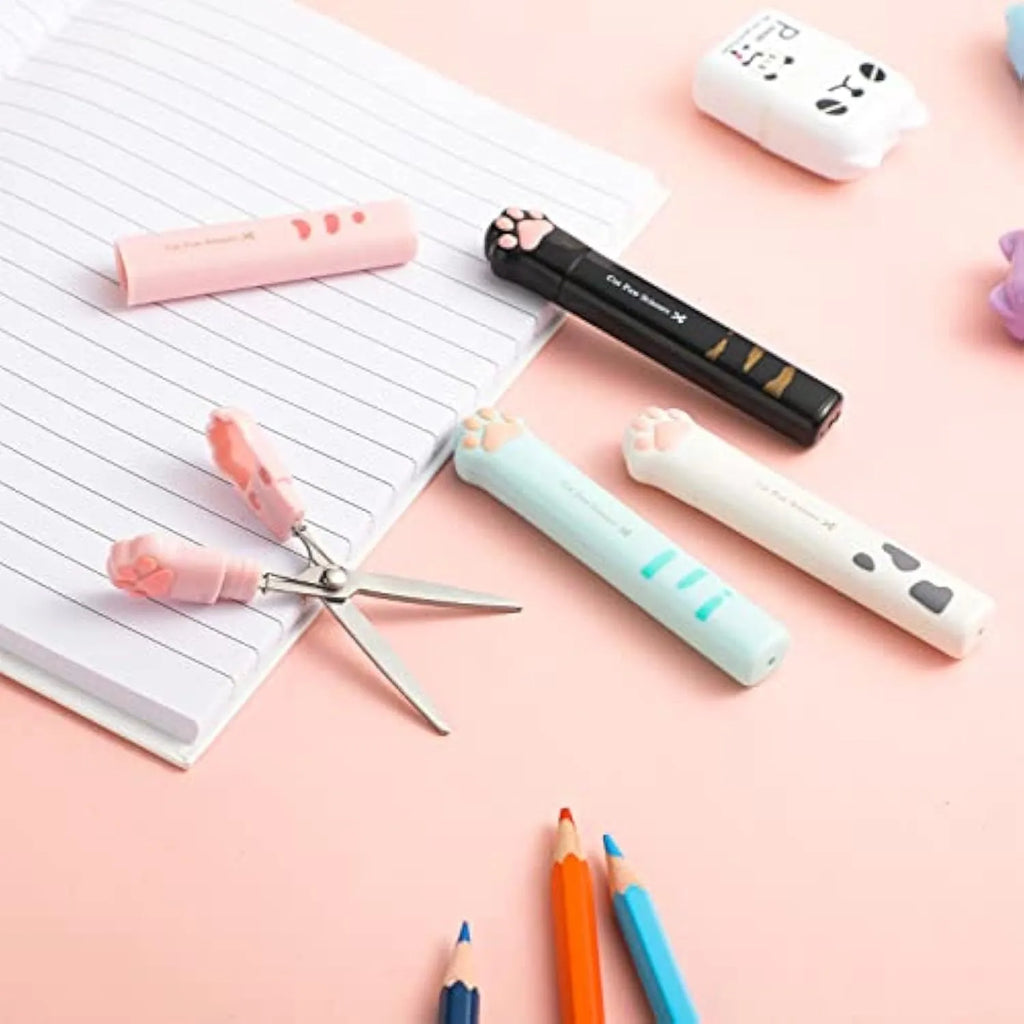 Folded cat paw mini scissors in stainless steel and plastic available in pink blue black and white colours measuring 8.7cm