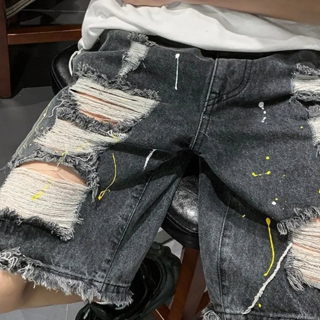 Men's loose fit light blue water washed denim shorts on a hanger.