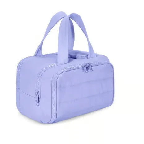 Large wide open travel toiletry bag in lightweight polyester with fluffy texture, showing interior space