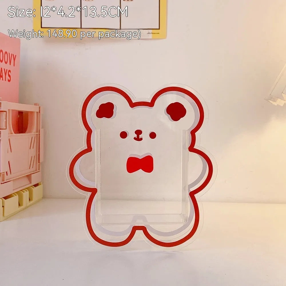 Clear square acrylic storage box with a cute decorative pattern, for stationery on a desk.