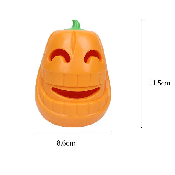 Orange Halloween pumpkin-shaped rubber dog chew toy with a treat-dispensing funnel hole.