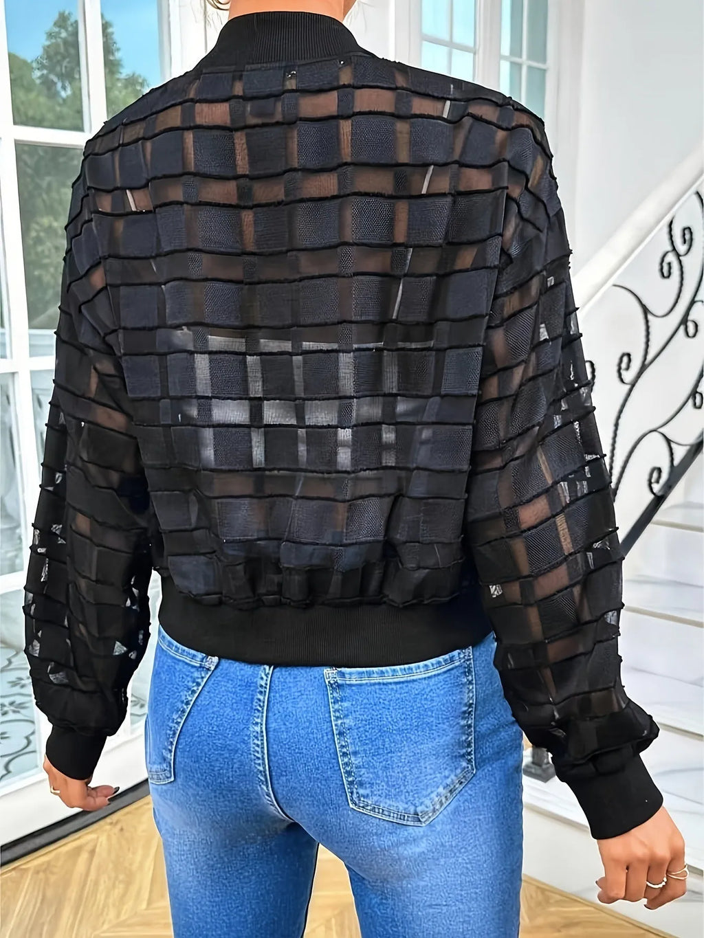 Black women's casual jacket with geometric pattern on semi-transparent polyester fabric featuring front zipper