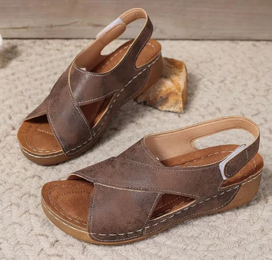 Roman-style women's platform sandals with an open toe and an adjustable Velcro ankle strap.