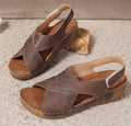 Roman-style women's platform sandals with an open toe and an adjustable Velcro ankle strap.
