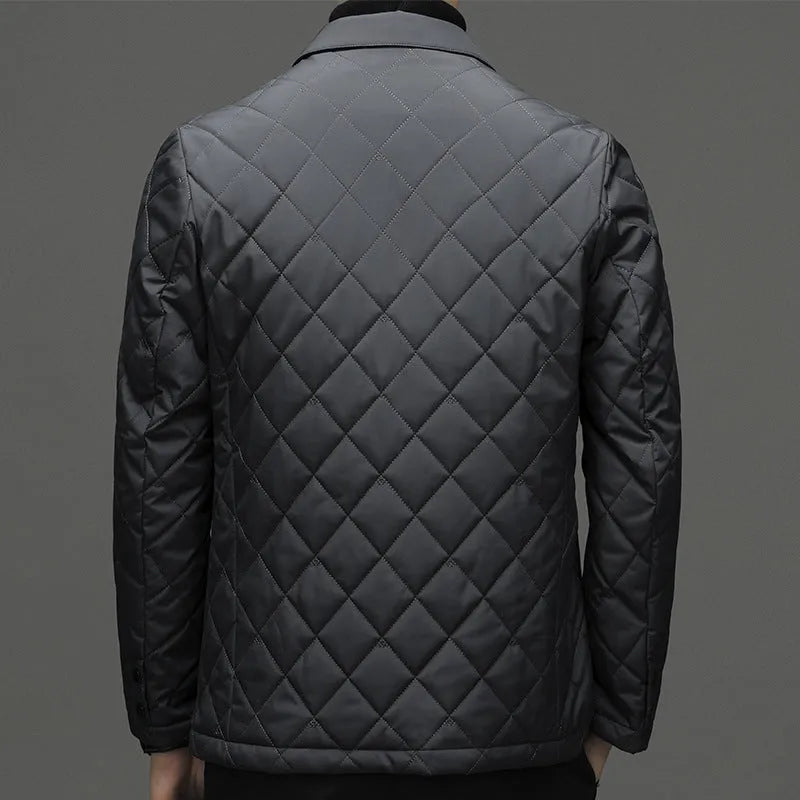 Man wearing a solid colour thickened lapel down jacket with side seam pockets.