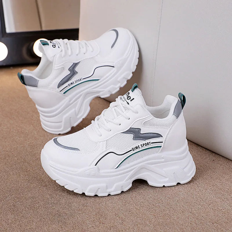 Women's white breathable mesh sports shoes with cross shoulder straps and built-in height increasing insoles.