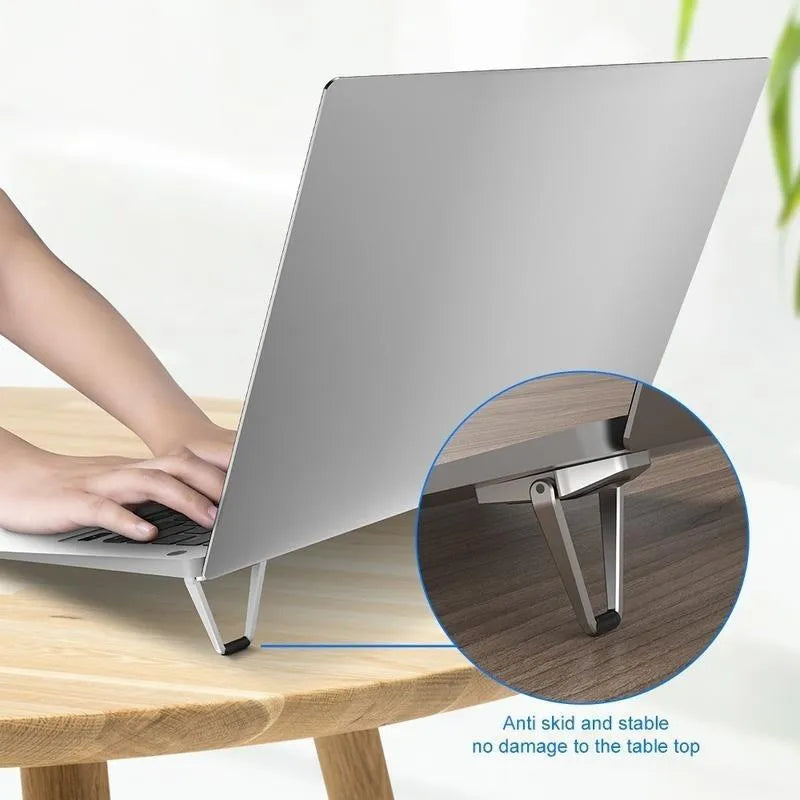 Portable aluminium alloy laptop stand bracket in silver and white foldable design