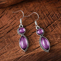 A pair of black and purple geometric vintage pendant earrings with a round detail, made from zinc alloy.
