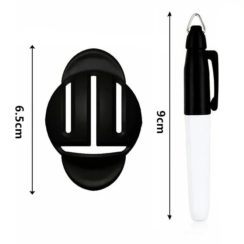Plastic golf putter alignment scriber tool with pens on a green background.