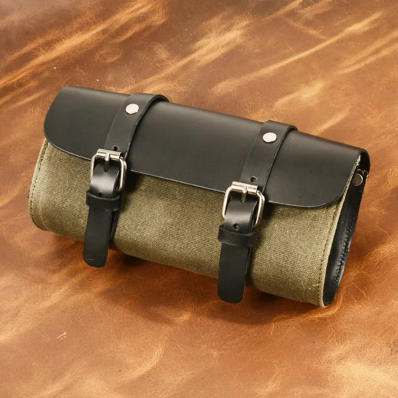 Cotton retro-style messenger bag showing internal organiser pockets and rivet detailing.
