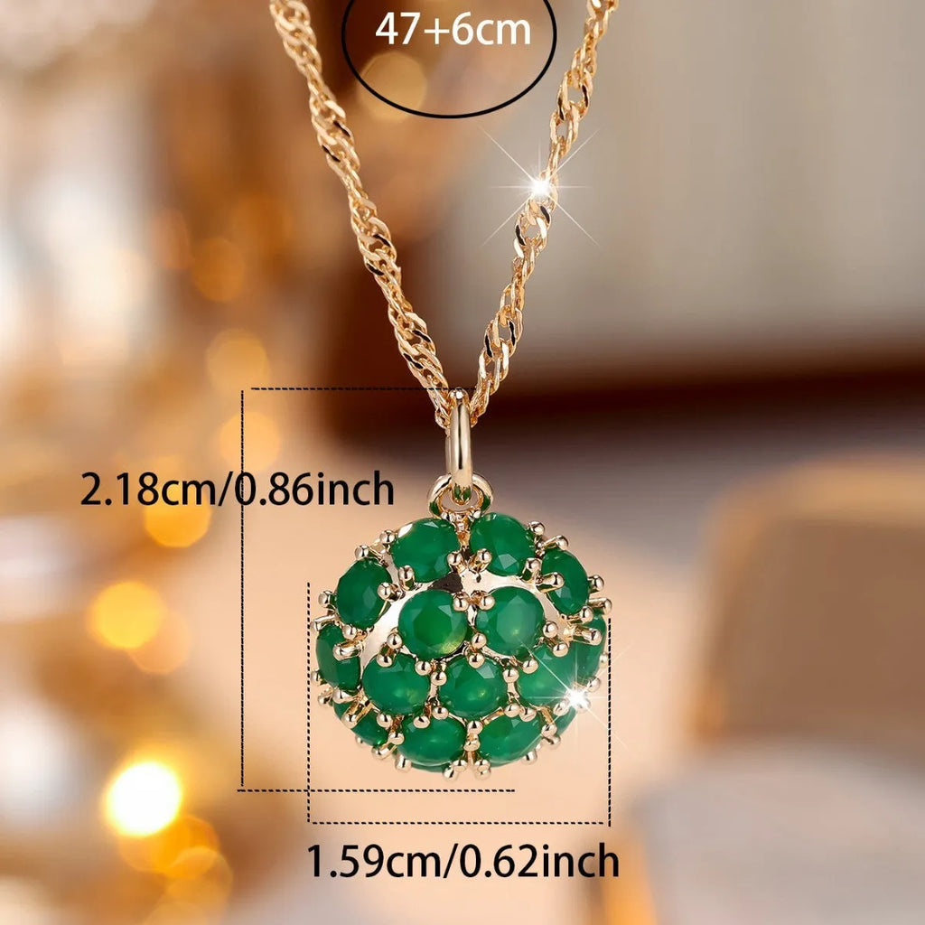 Round emerald pendant necklace with full diamond detailing in champagne gold colour on chain