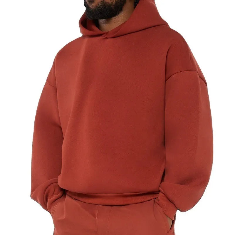 Men's solid color fleece-lined pullover hoodie with threaded long sleeves in gray, black, blue, or red.