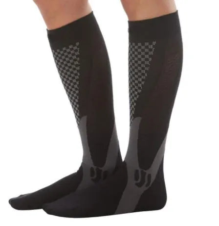 Black graduated compression socks with athletic fit for men and women, shown laid flat.