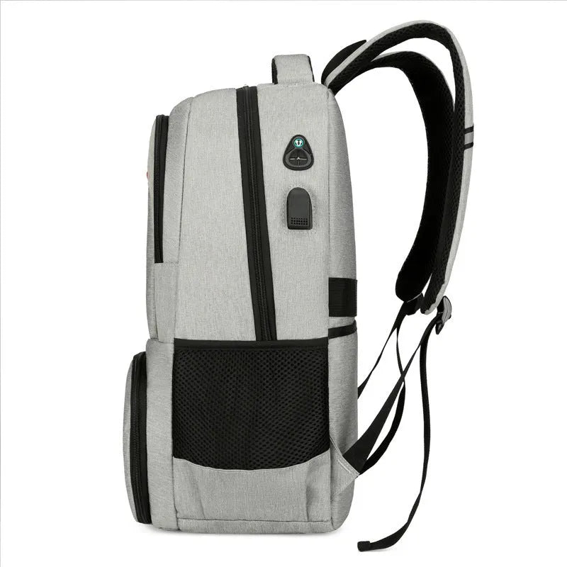 Light grey insulated oxford cloth backpack with curved shoulder straps and front compartments.