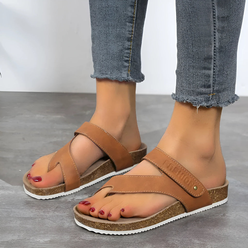 Flat toe ring thick-soled flip-flops in a solid colour on a foam sole.