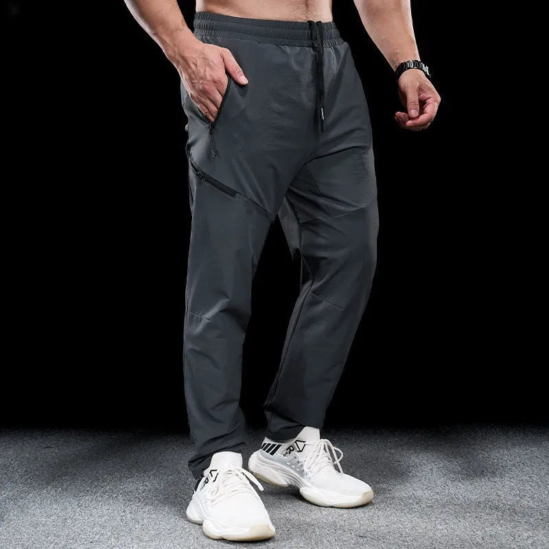 Men's waterproof quick-dry workout trousers in nylon fabric for sports and fitness