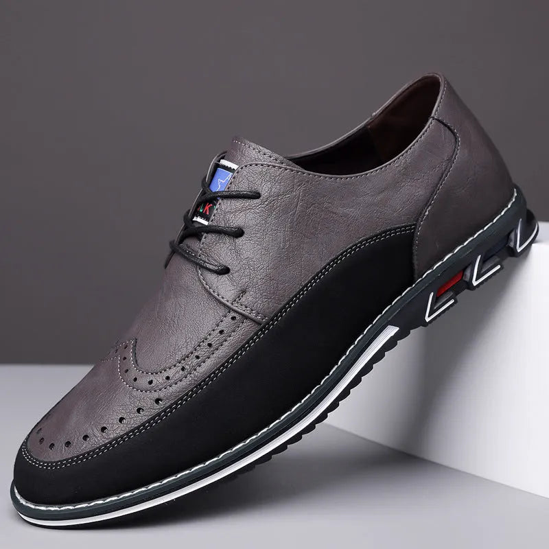 Men's black leather toe cap casual shoes with a fabric upper and rubber sole on a white background.