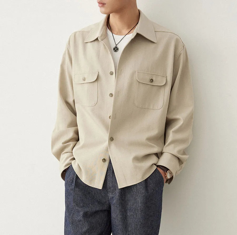Men's light sand rice colour casual long sleeve shirt with a simple lapel, on a hanger.