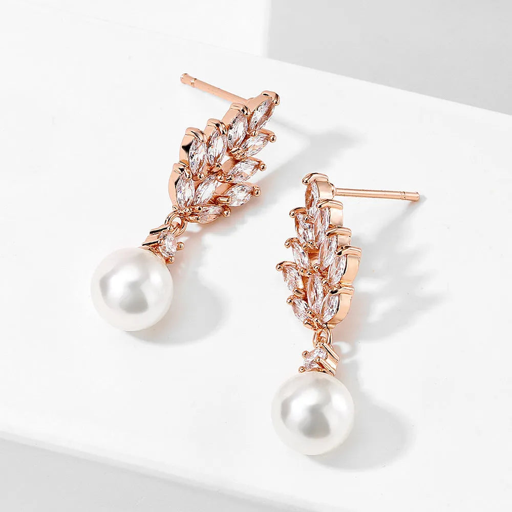Geometric flower earrings with zircon stones and pearl accents in gold, white gold, or rose gold plating