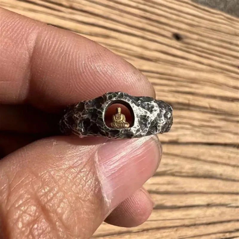 Copper Buddha ring with rock texture surface showing hand-forged details and Buddhist imagery