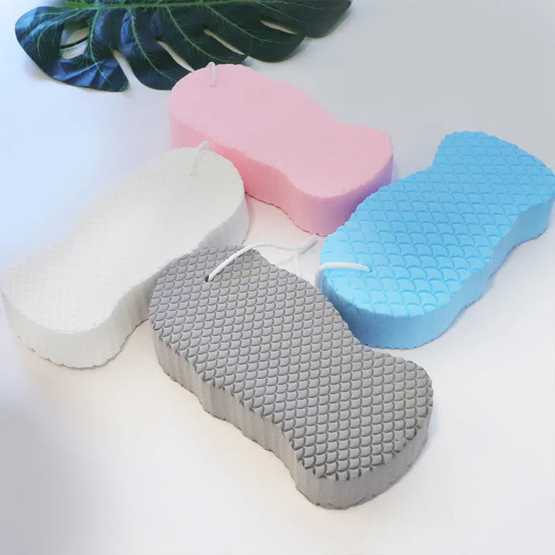 3D fish scale pattern bath sponge in light blue colour showing textured exfoliating surface