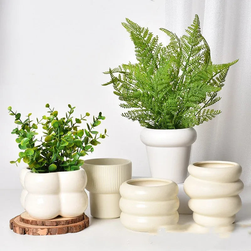 Matte yellow ceramic flower pot with Roman column colour finish for home plant decoration.