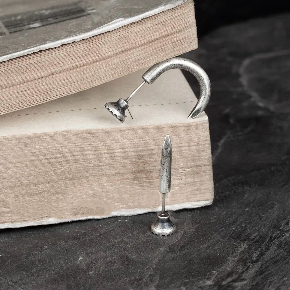 S925 sterling silver nail-shaped stud earring on an ear hook, punk style.