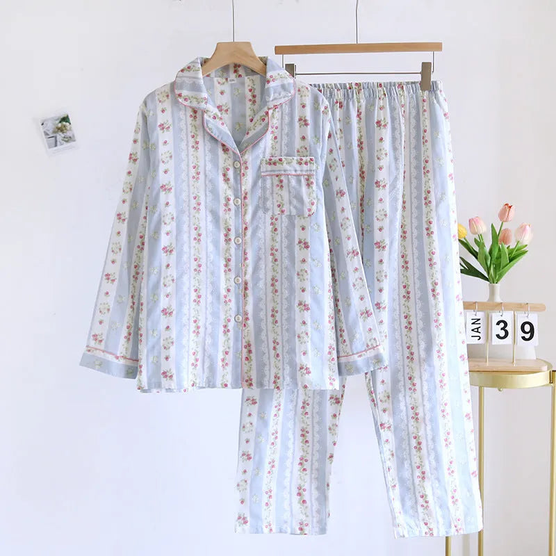 Ladies' red small fruit print cotton gauze long-sleeved top and matching trousers homewear set laid flat.