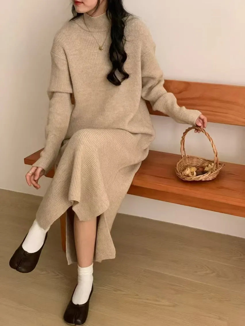 Woman wearing a beige half-turtleneck, high-waisted, knee-length acrylic knit dress.
