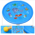 Blue PVC children's water spray mat with marine animal designs laid on grass, connected to a garden hose.