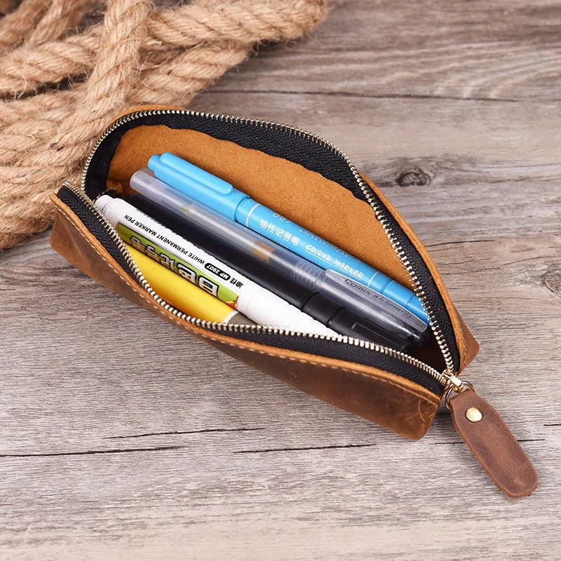 Square leather pencil case with zipper closure in black, brown, dark brown, or yellow colour