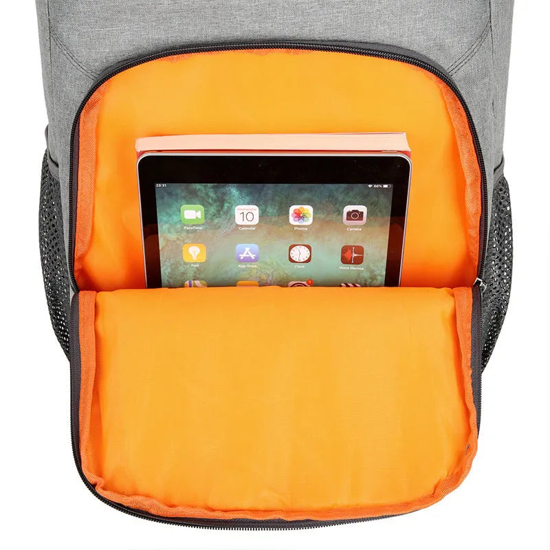 Large black outdoor backpack with curved shoulder straps showing expansion compartments for thermal picnic storage